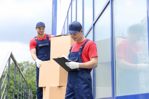 Same day removals team navigating a busy Islington street