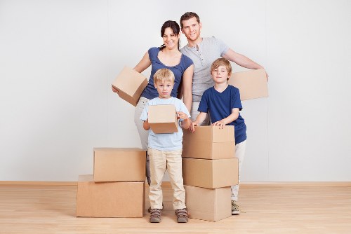 Packed moving boxes and furniture ready for house removals in Islington