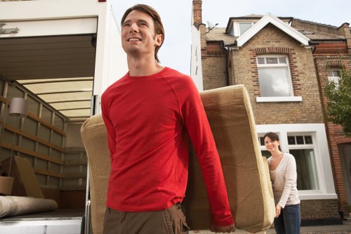 Removal team loading boxes for a student move in Islington