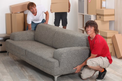 Furniture and boxes being unloaded at a property in Islington