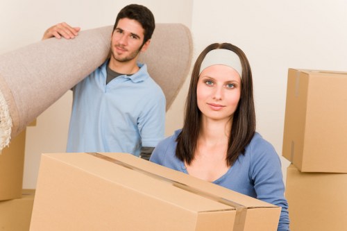 Packed boxes and workstation items ready for a business move in Islington