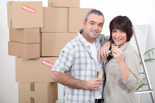 Local movers handling furniture in a flat in Islington